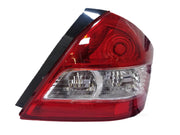 Rear tail light for a Suzuki Dzire 2012-2017, featuring a red cover with clear and silver components visible behind.