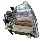 Chrome car headlight on a white background