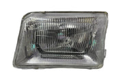 A single headlight for Tata 207 DI vehicle model, featuring a clear, water-resistant, break-proof glass lens with a silver-colored reflector.