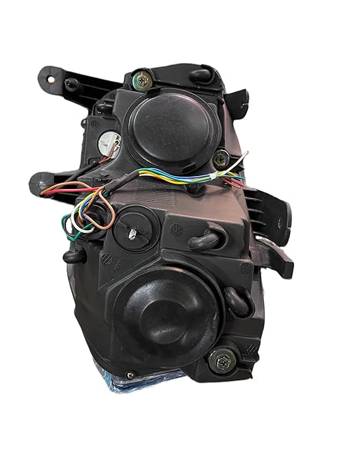 A white projector headlight for the Mahindra Scorpio vehicle, showcasing the front view with clear glass and metal assembly.