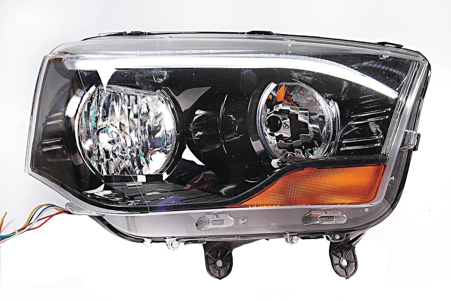 A Mahindra Scorpio car headlight without projector, featuring a halogen bulb and waterproof design.