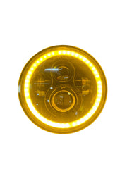 Round yellow headlight with LED halo on a white background