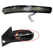 An image showing a black Hyundai I20 side door mirror with a built-in indicator light.