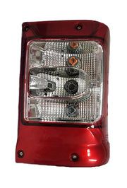 Red tail light assembly for Mahindra Bolero Type 4 featuring brake lights, with a clear lens and reflector design.