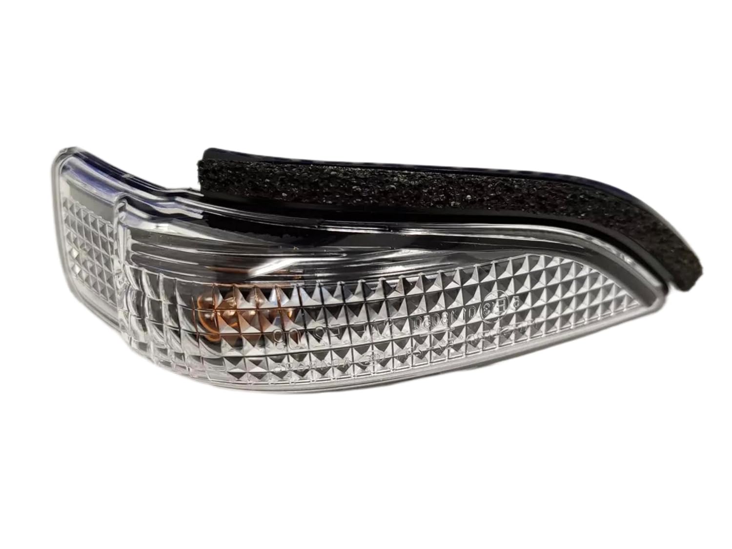 An image showing a side mirror indicator for a vehicle, with a focus on the glass lens part of the mirror.