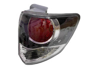 Black tail light for Toyota Fortuner Old Model, featuring a clear glass and red-colored reflector.