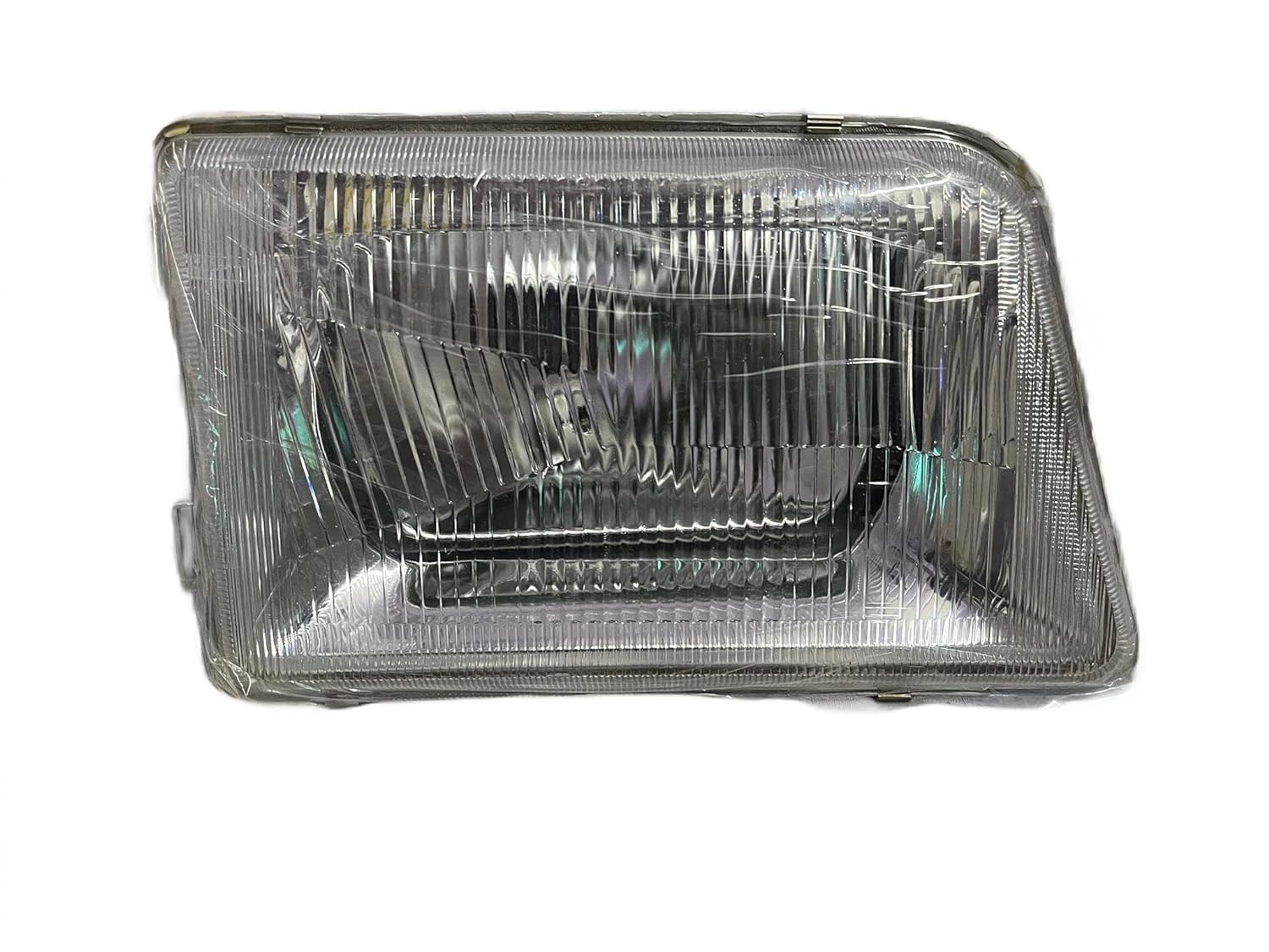 A single headlight for Tata 207 DI vehicle model, featuring a clear, water-resistant, break-proof glass lens with a silver-colored reflector.
