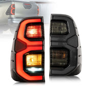Hilux black housing LED tail light

Toyota Hilux rear lamp smoked lens