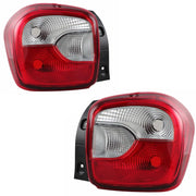 A set of two tail lights for a Maruti K10 vehicle, featuring clear and red lens sections with reflector technology.