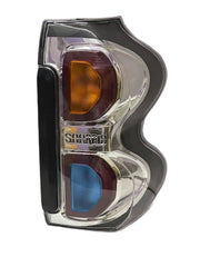 Rear tail light for Mahindra Scorpio S10 with blue and orange colored lenses.
