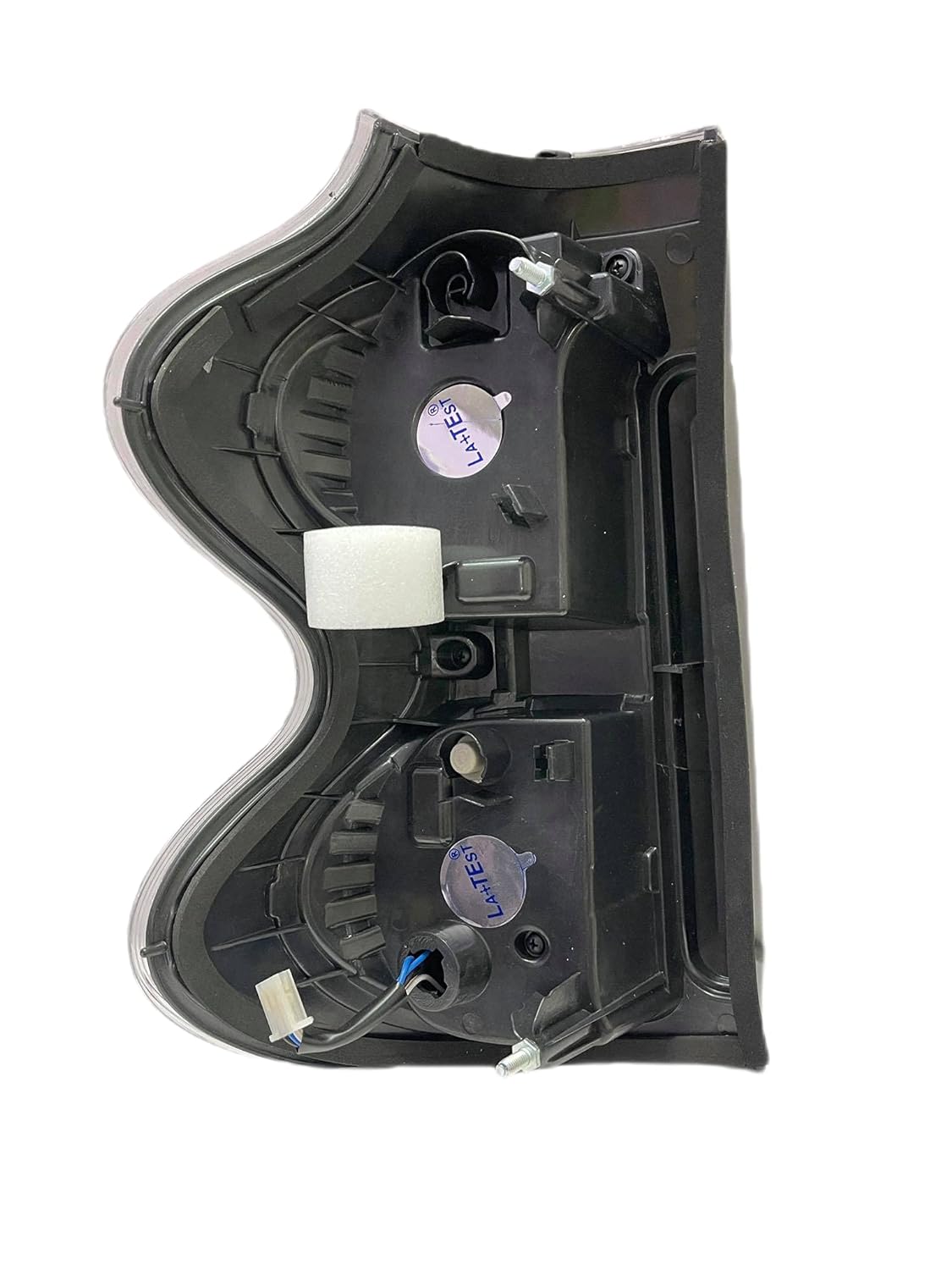 A white, halogen K D tail light for Mahindra Scorpio S10.