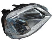 A single chrome-plated headlight assembly for a Mahindra Logan vehicle. The headlight is shatter-resistant and has a clear lens cover.