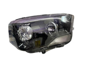 A white K D brand headlight for Mahindra Scorpio vehicle, without projector and with a clear lens.