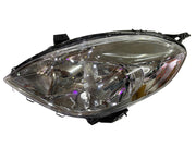A pair of K D brand headlight units for Nissan Sunny, featuring clear lenses and halogen bulbs, without adjustable motors.
