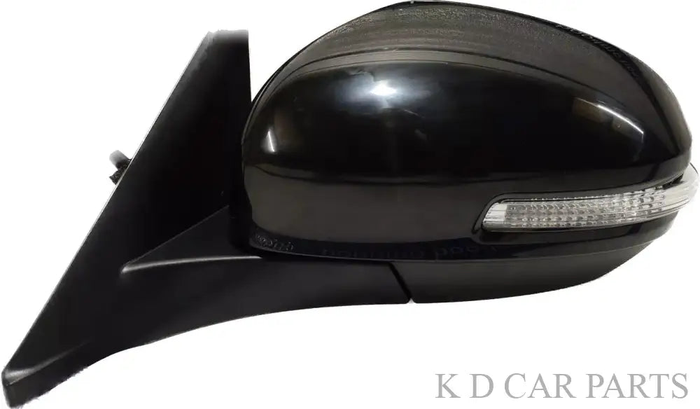 Black side door mirror with an integrated indicator for Maruti BREZZA motor.