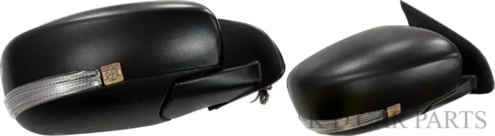 A pair of black, curved side/door mirrors for Maruti Dzire 2017-now models with indicators, mounted on a vehicle.