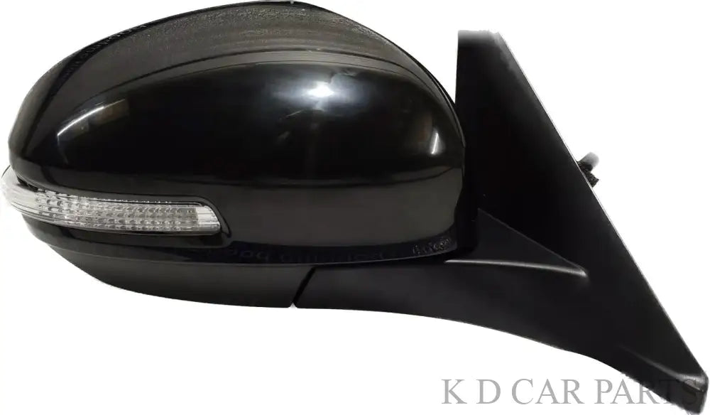 A black, clear K D side/door mirror for Maruti BREZZA motor with an automatic fold, including the mounting hardware.