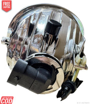 Chrome vehicle headlight with black components on a white background