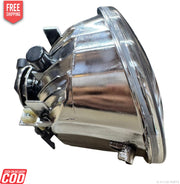 Chrome car headlight on a white background