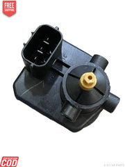 Black mechanical component with a yellow part on a white background