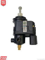 Black mechanical component with a label on a white background