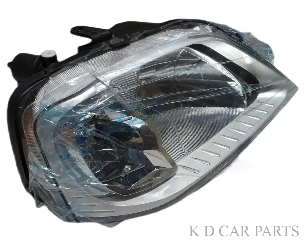 A single chrome-plated headlight assembly for a Mahindra Logan vehicle. The headlight is shatter-resistant and has a clear lens cover.