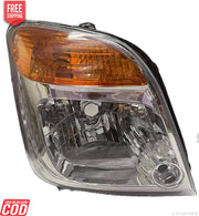 Headlight assembly for Maruti Suzuki WagonR Type 3, featuring a clear lens, reflector, and orange turn signal.
