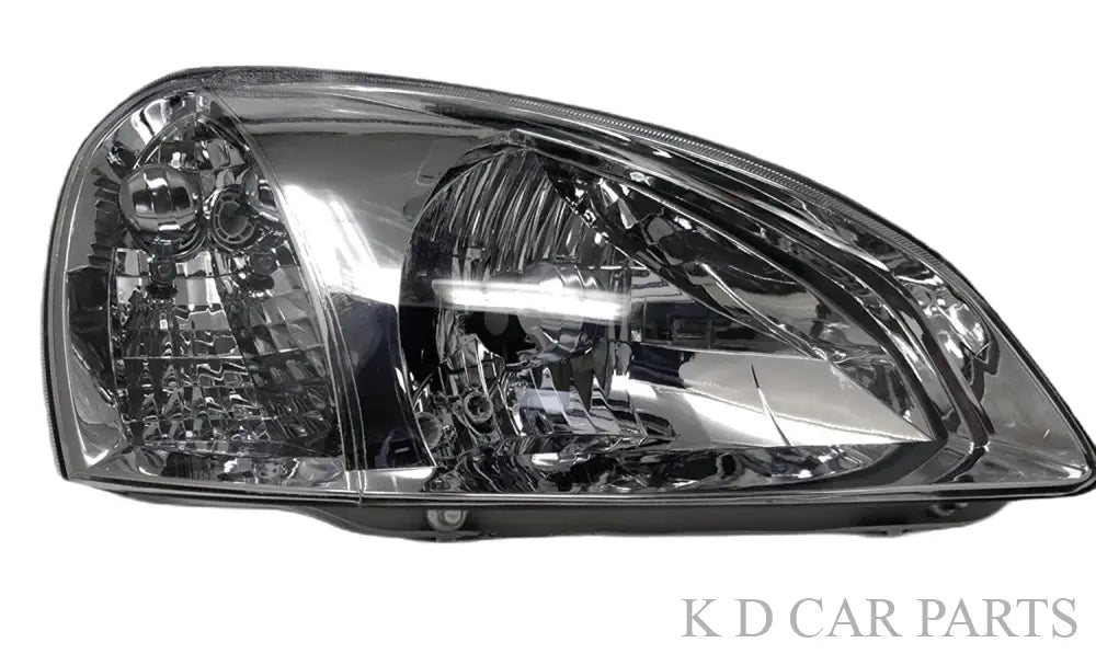 A K D brand headlight assembly designed for specific Tata vehicle models, showcasing a clear lens and reflective interior.