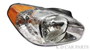 A single headlight assembly for Verna 2006-2009 with a clear lens and a wooden-colored section near the base.