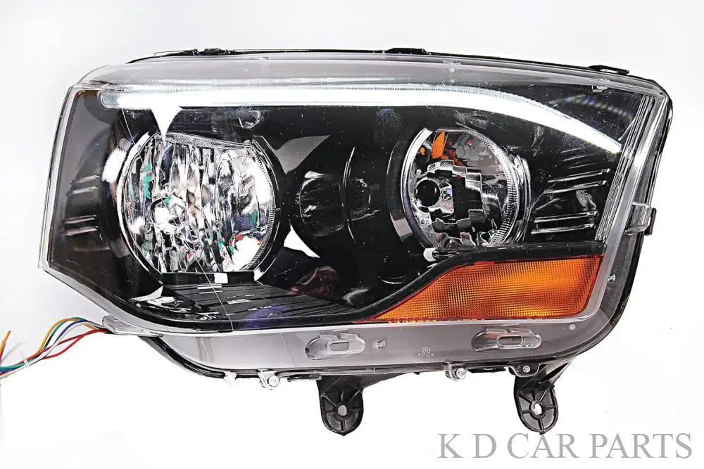 A Mahindra Scorpio car headlight without projector, featuring a halogen bulb and waterproof design.