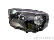 A white K D brand headlight for Mahindra Scorpio vehicle, without projector and with a clear lens.