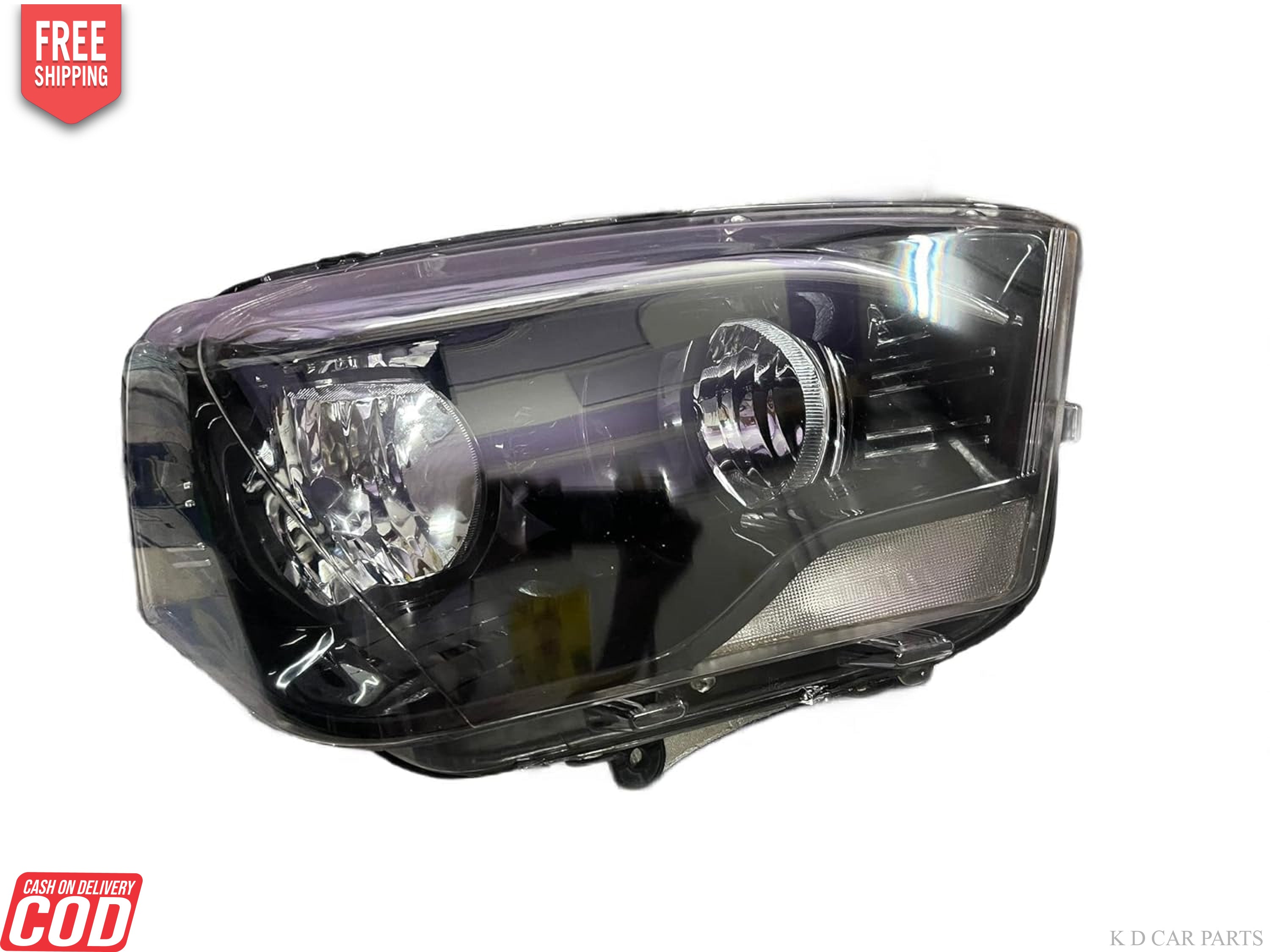 A white K D brand headlight for Mahindra Scorpio vehicle, without projector and with a clear lens.
