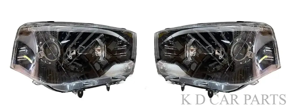 A white K D brand headlight for Mahindra Scorpio vehicle, without projector and with a clear lens.