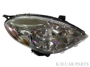 A pair of K D brand headlight units for Nissan Sunny, featuring clear lenses and halogen bulbs, without adjustable motors.