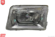 A single headlight for Tata 207 DI vehicle model, featuring a clear, water-resistant, break-proof glass lens with a silver-colored reflector.