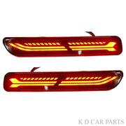 A pair of red K D Matrix rear bumper reflectors for Maruti vehicles, featuring a clear acrylic lens and a red-black-clear design.
