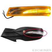 A K D brand side/door mirror indicator for c, featuring a yellow lens and black housing, shown from the front and a close-up of the mounting area.