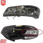 A K D brand side/door mirror indicator for Mahindra XUV500, showing the mirror assembly with clear glass and a black frame, along with a close-up of the mirror with a red highlight indicating the part to be painted.