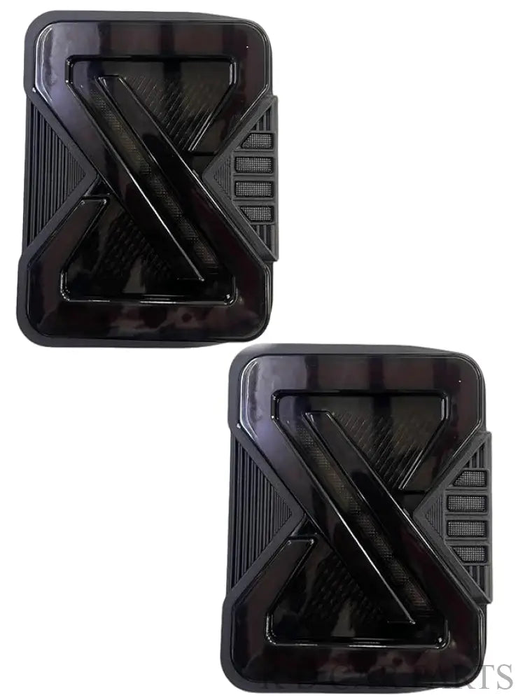 A pair of smoky black LED taillights designed for the Mahindra THAR, displayed in isolation and installed on a vehicle.