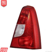 Red tail light assembly for a vehicle, featuring a clear lens and a red-colored housing.