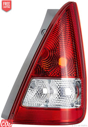 Tail light assembly for Maruti ZEN Estilo featuring red and clear glass with a classic design.