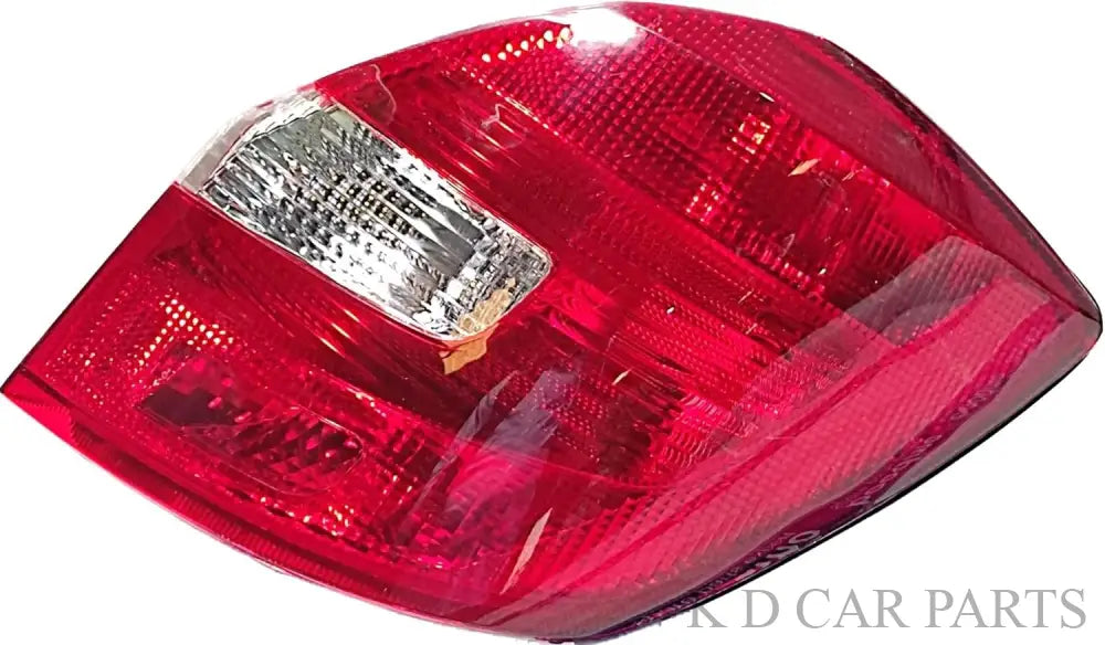 Red tail light assembly for Skoda Fabia 2008-2013, featuring clear glass and a chrome-colored lens.