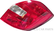 Red tail light assembly for Skoda Fabia 2008-2013, featuring clear glass and a chrome-colored lens.