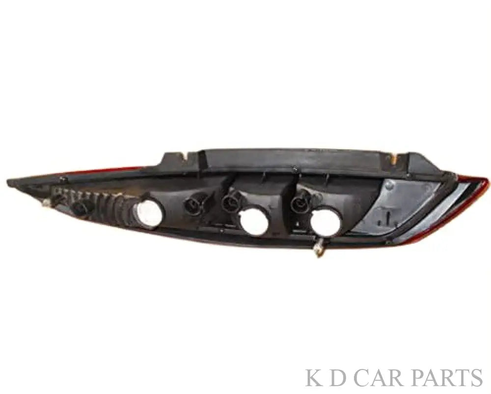 A red tail light assembly for Tata Nano 2009-2018 with clear and red lenses visible.