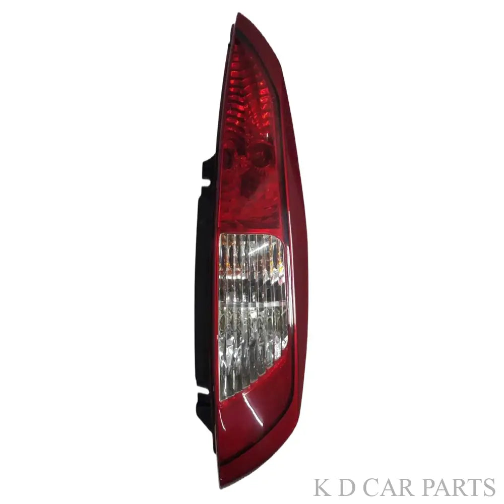 A red tail light assembly for Tata Nano 2009-2018 with clear and red lenses visible.