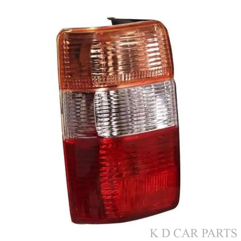 Red tail light assembly for Toyota Qualis, models 1999-2004, with a clear and red-tinted lens.