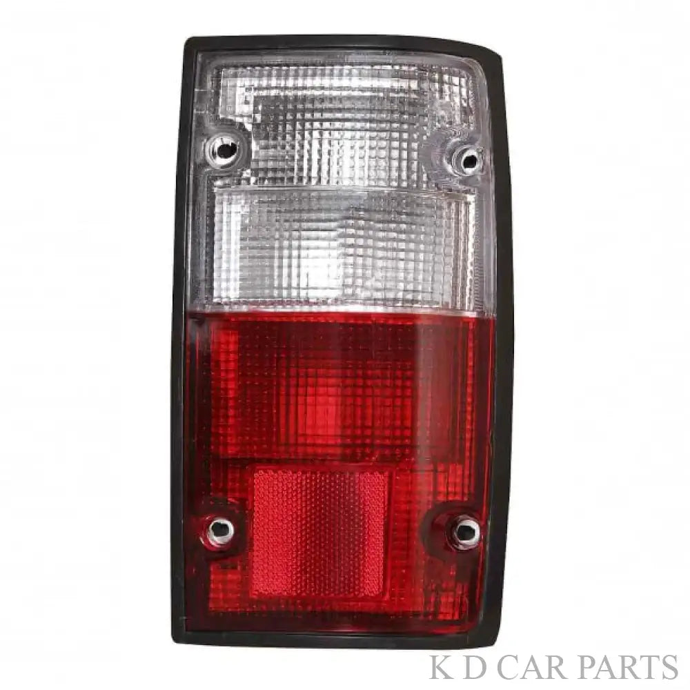 A red and clear tail light assembly for a Toyota vehicle, specifically designed for the Qualis old model (1999-2004).