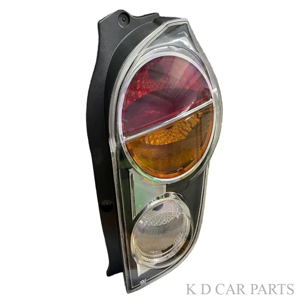 Rear tail light for Chevrolet Beat model years 2010-2014, featuring a white light with a red lens and yellow reflector.