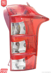 A red tail light for a vehicle, presumably made of plastic and glass, with a clear and red color scheme.