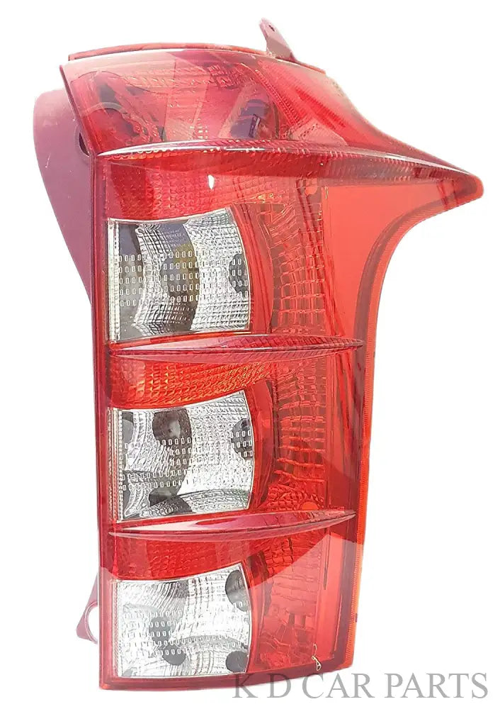 A red tail light for a vehicle, presumably made of plastic and glass, with a clear and red color scheme.